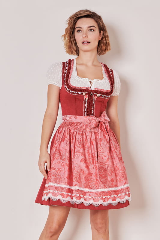 Dieser traditionelle Klassiker lässt dein Trachtenherz höher schlagen. Das schlichte Design verleiht dem taillierten Dirndl einen dezenten