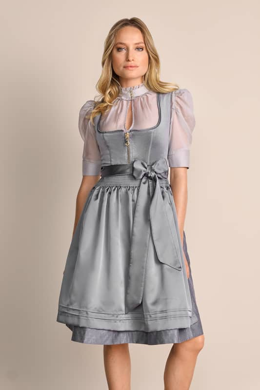 Elegantes Limited Edition Dirndl Ester in modernem Stil wartet auf dich. Dieses unifarbene Dirndl ist tailliert geschnitten und betont so deine Figur auf wundervolle Weise. Der Rock